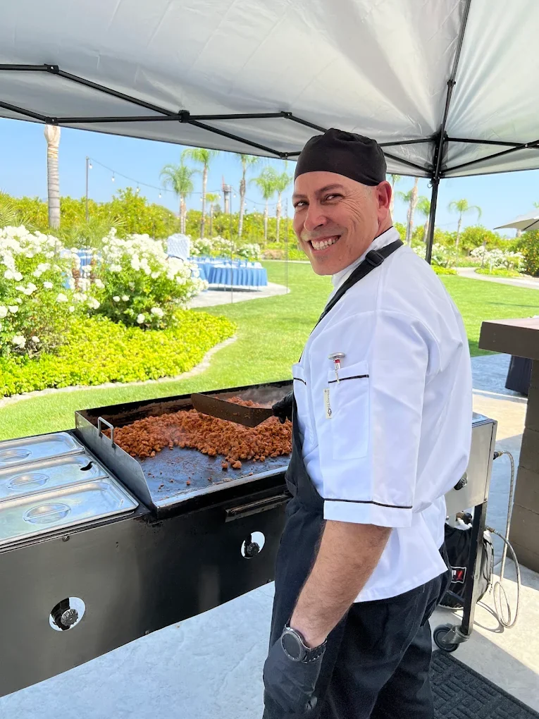 Chef preparing carne asada on-site